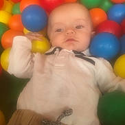 Naël a rejoint le concours — aidez-le/la à gagner de superbes lots ! baby, ball_pit, balls, calm, casual_clothing, child, colorful, cute, indoor, infant, leisure, pants, person, play, portrait, relaxation, shirt, soft_focus, toy, young