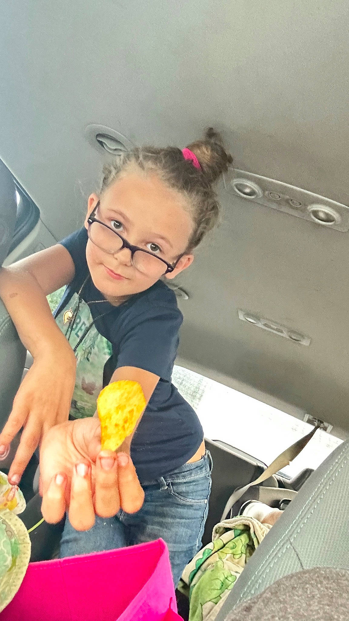 Lillian is registered to the contest to win money with this photo: child, comfort_food, cooking, cuisine, dish, eyewear, finger_food, food, food_craving, fun, glasses, junk_food, nail, person, recipe, sweetness, tableware, thumb, toddler, vehicle_door