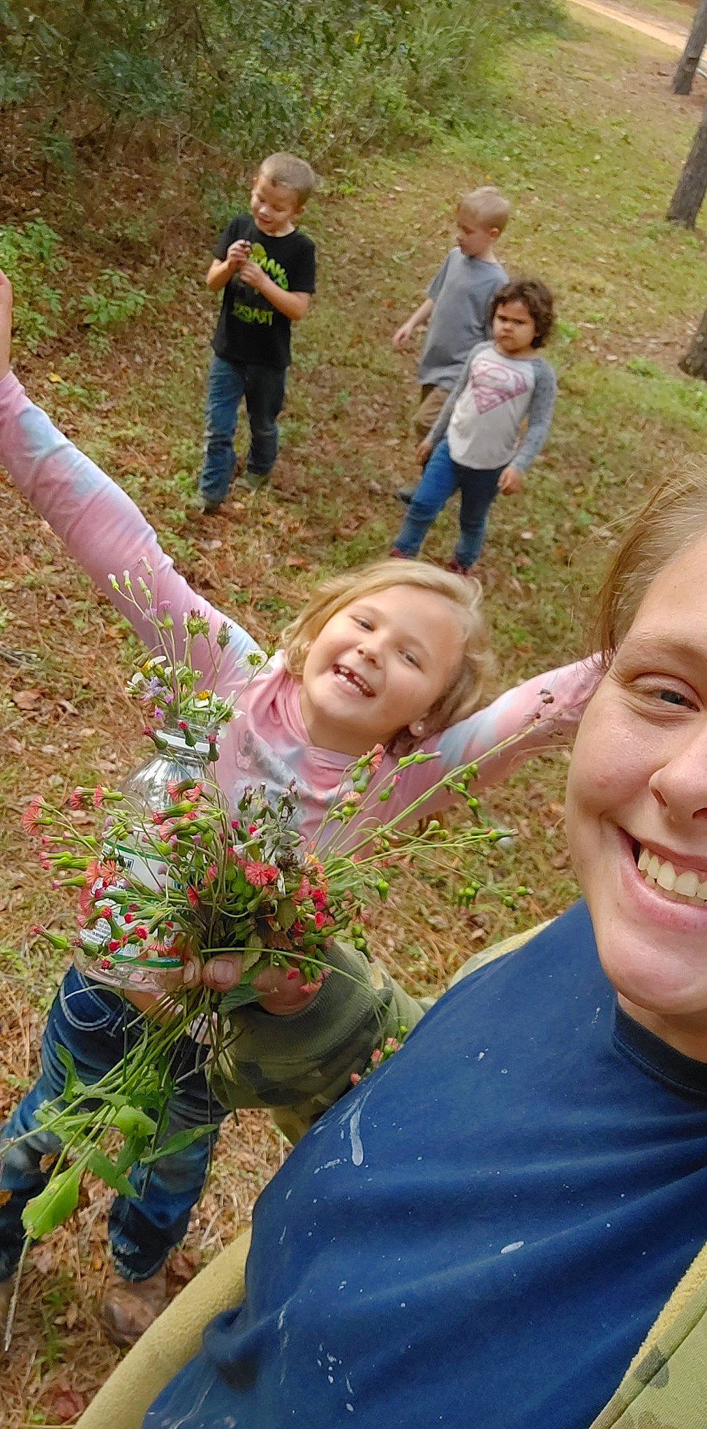 Melanie joined the competition — help win amazing prizes! adaptation, botany, clothing, face, gesture, grass, green, groundcover, happy, head, joy, leaf, leisure, natural_environment, nature, people, people_in_nature, person, photograph, plant