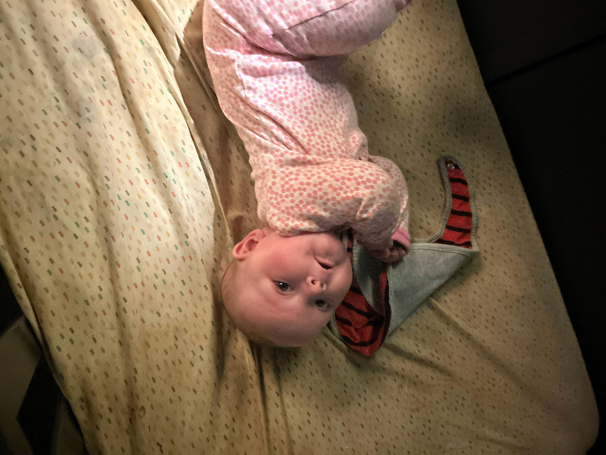Gracelynn is registered to the contest to win money with this photo: arm, baby, chin, comfort, elbow, eye, eyebrow, flash_photography, floor, flooring, hardwood, human_body, human_leg, leg, mouth, neck, nose, person, textile, toddler