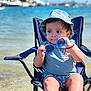 Ismael joined the competition — help win amazing prizes! beach, blue_clothing, chair, child, cute, hat, holiday, outdoor, person, portrait, relaxing, sand, summer, sun_protection, sunglasses, sunny, toddler, vacation, water, waterfront