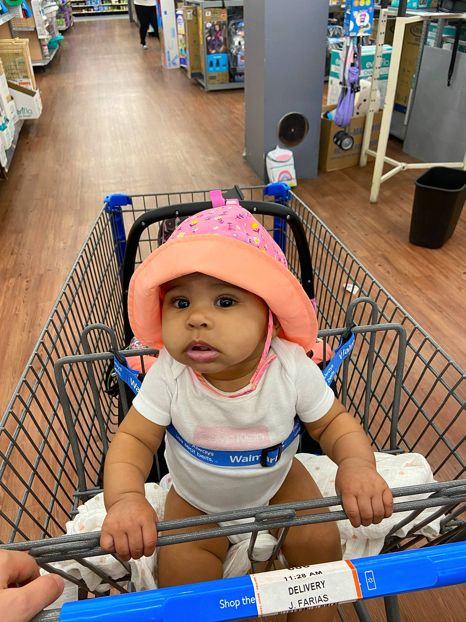 Chanel is registered to the contest to win money with this photo: baby, blue, cap, child, electric_blue, flooring, fun, happy, hat, headwear, leisure, person, photograph, product, recreation, shorts, snapshot, standing, t_shirt, toddler