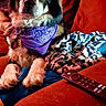 Aurora is registered to the contest to win money with this photo: dog, purple_bandana, couch, blanket, remote_control, indoor, pet, fur, animal, relaxed, mammal, ears, face, paw, looking, comfort, home, domestic_animal, furniture, resting