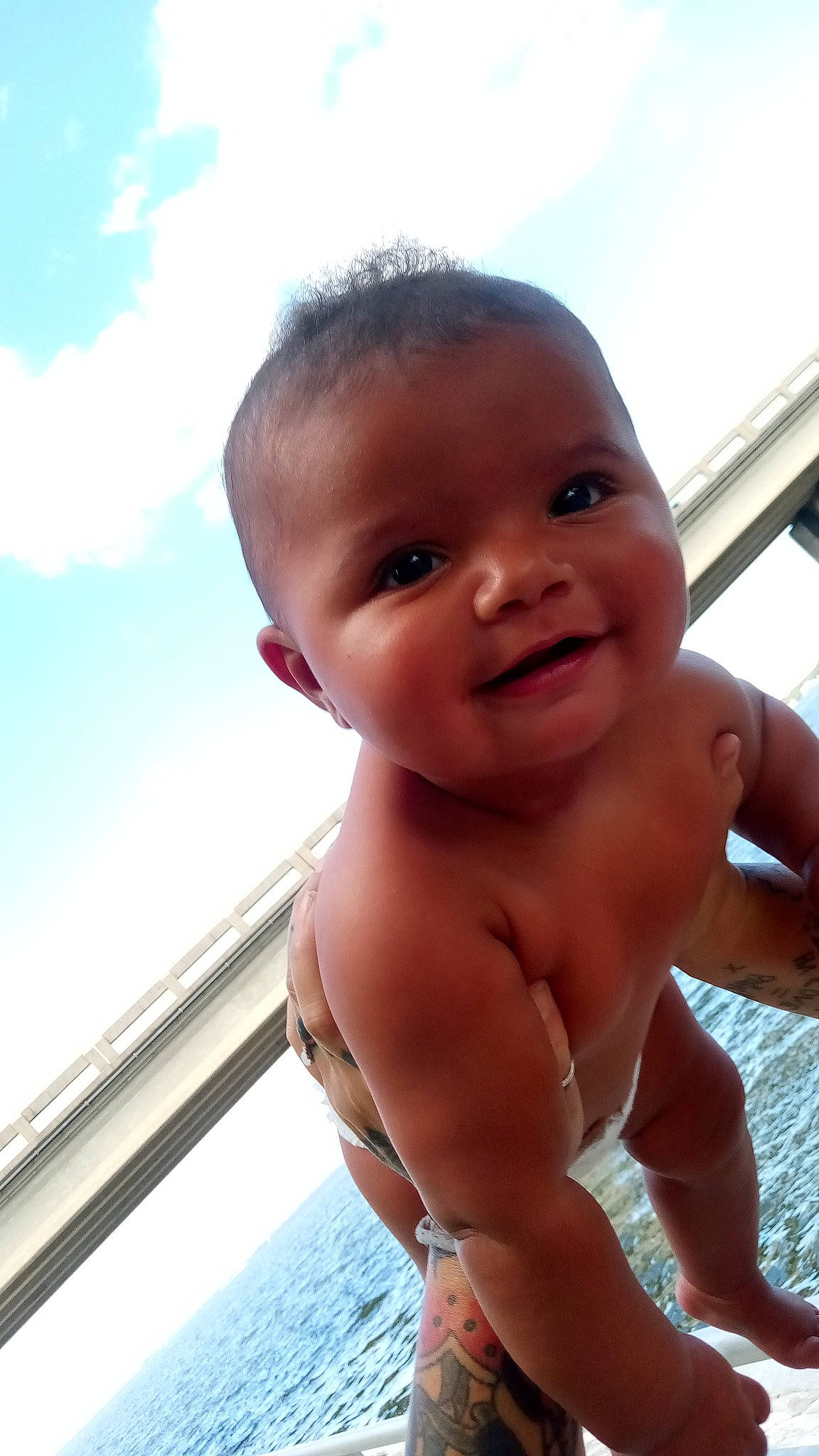 Asia is registered to the contest to win money with this photo: azure, baby, cheek, chest, child, chin, cloud, fun, gesture, happy, joy, leisure, lip, nose, person, skin, sky, smile, summer, thumb