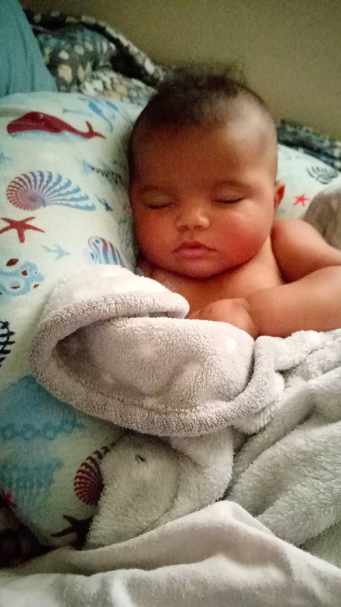 Asia is registered to the contest to win money with this photo: arm, baby, baby_sleeping, cheek, chin, comfort, eye, eyebrow, finger, gesture, hand, lip, mammal, mouth, nose, person, product, skin, textile, thumb