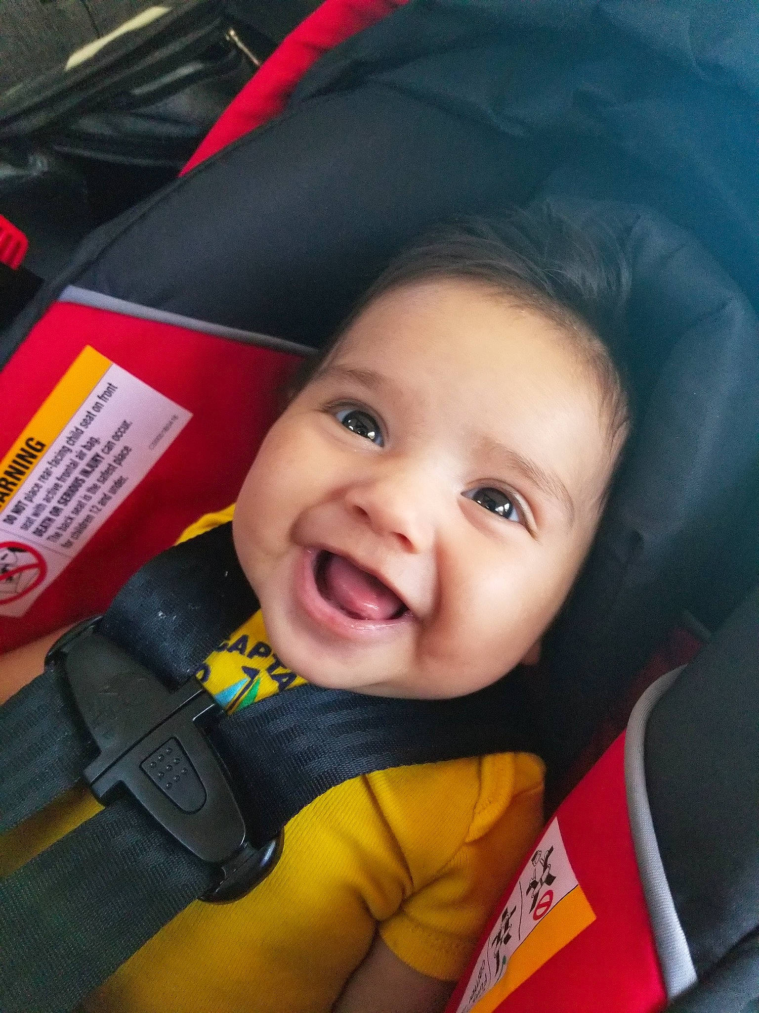 Oscar Jr. joined the competition — help win amazing prizes! baby, baby_in_car_seat, cheek, child, eye, face, facial_expression, fun, happy, head, joy, lifejacket, lip, mouth, nose, person, personal_protective_equipment, seat_belt, skin, smile