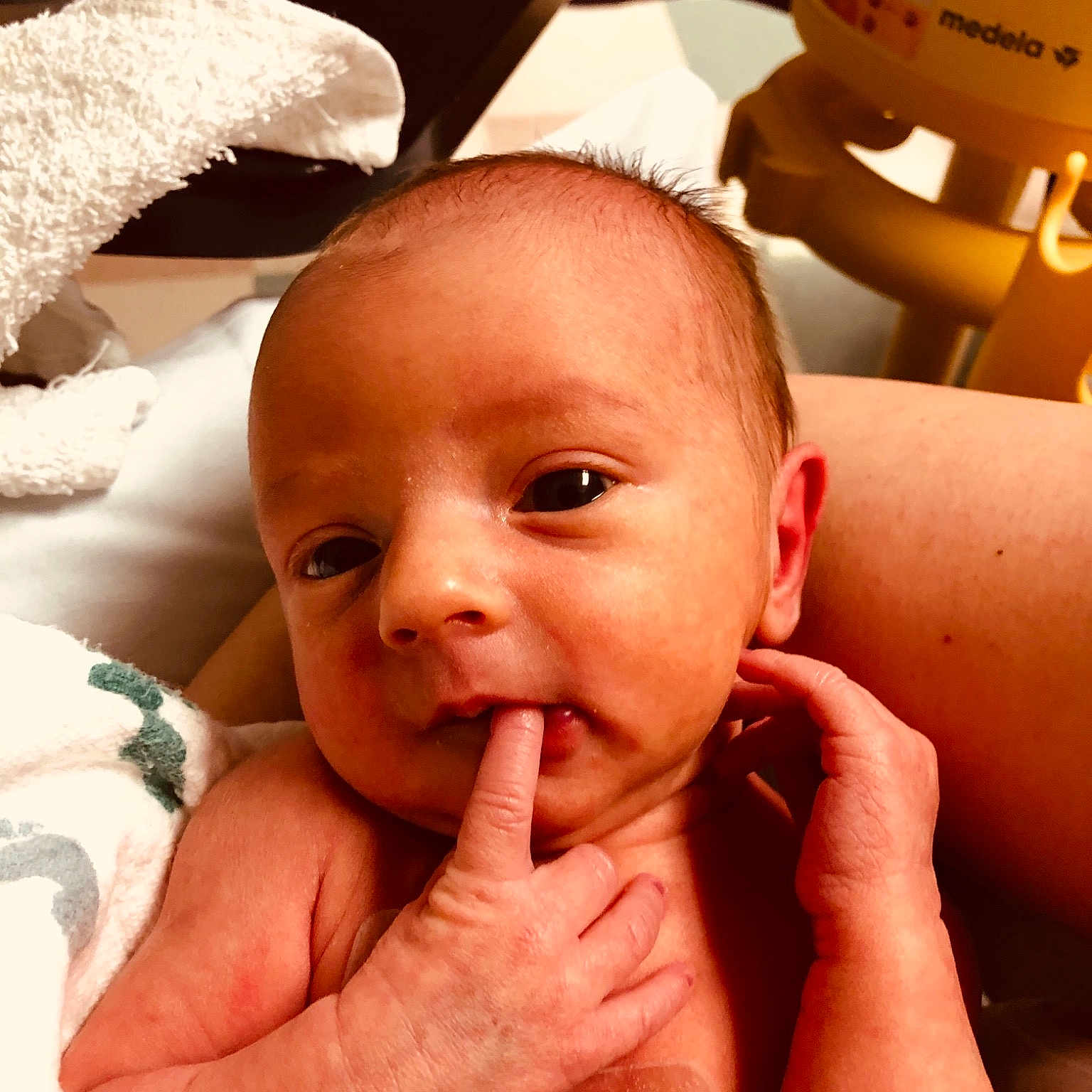 Emiliah is registered to the contest to win money with this photo: cheek, child, chin, ear, finger, hand, infant, lip, mouth, nail, neck, nose, person, skin, toddler