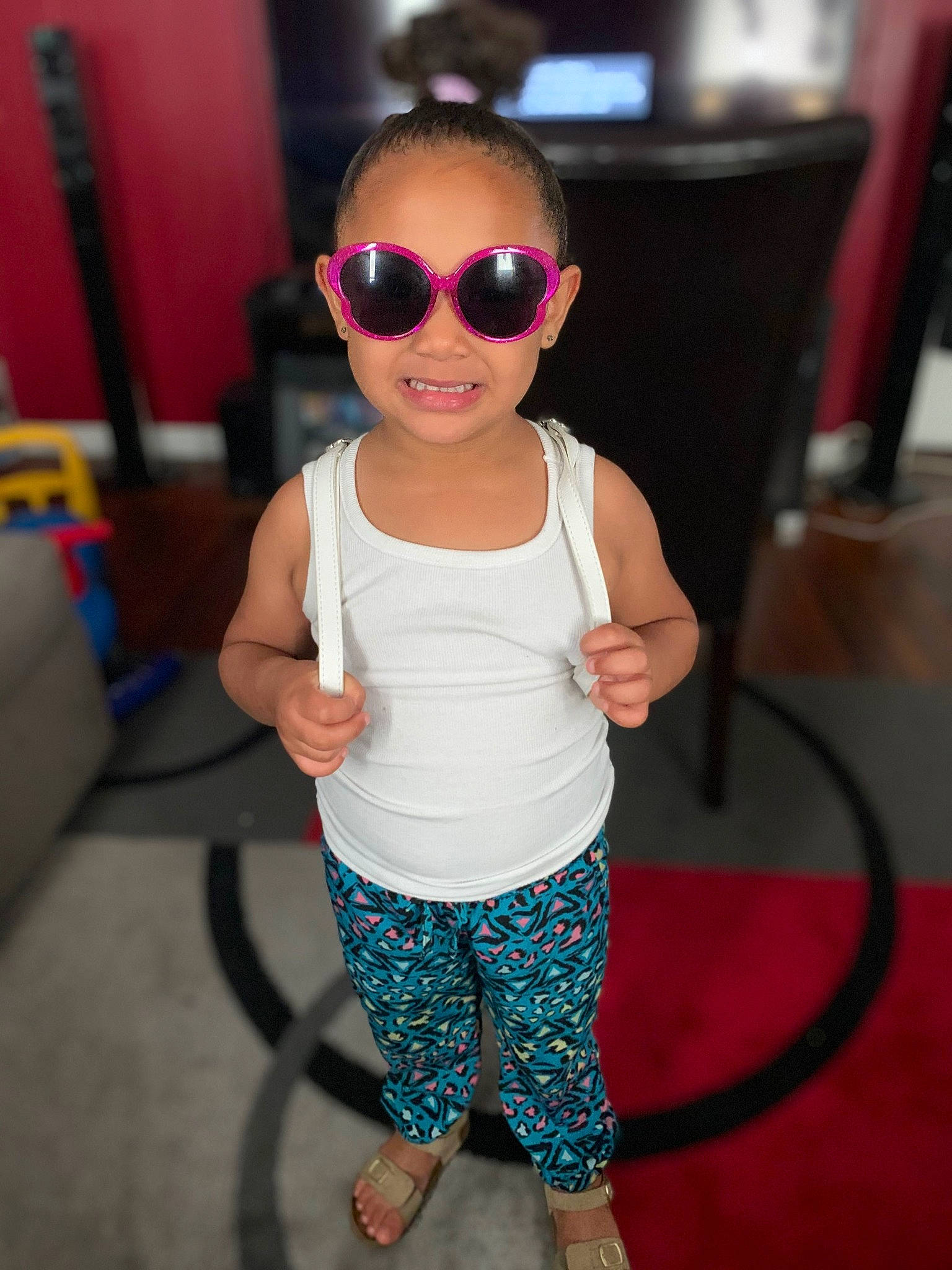 Marisa joined the competition — help win amazing prizes! arm, child, cool, eyewear, fashion_accessory, fun, glasses, joy, leg, person, room, smile, sunglasses, t_shirt, toddler, toy, vacation, vision_care