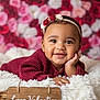 baby, smiling, headband, flower, blanket, basket, portrait, child, cute, happy, indoor, red, pink, white, cozy, warm, soft, face, person, newborn