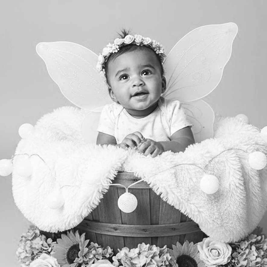 Nel joined the competition — help win amazing prizes! adorable, baby, basket, black_and_white, blanket, child, cute, decorative, fairy_wings, flower_headband, flowers, happy, infant, innocent, portrait, posing, smiling, soft_texture, studio, young_child