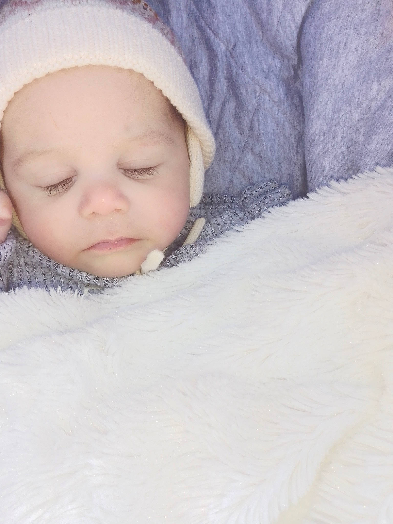 Emily Stiemer participe au concours pour gagner de l'argent avec cette photo : baby, baby_sleeping, baby_toddler_clothing, bedtime, cap, cheek, comfort, eye, face, freezing, fur, happy, head, knit_cap, linens, nose, outerwear, person, toddler, towel