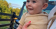 Wesley joined the competition — help win amazing prizes! baby, blue_sky, casual, child, daytime, dirt, fence, grass, hand, happy, holding, nail_polish, nature, outdoor, person, portrait, ring, short_sleeve, smile, vehicle