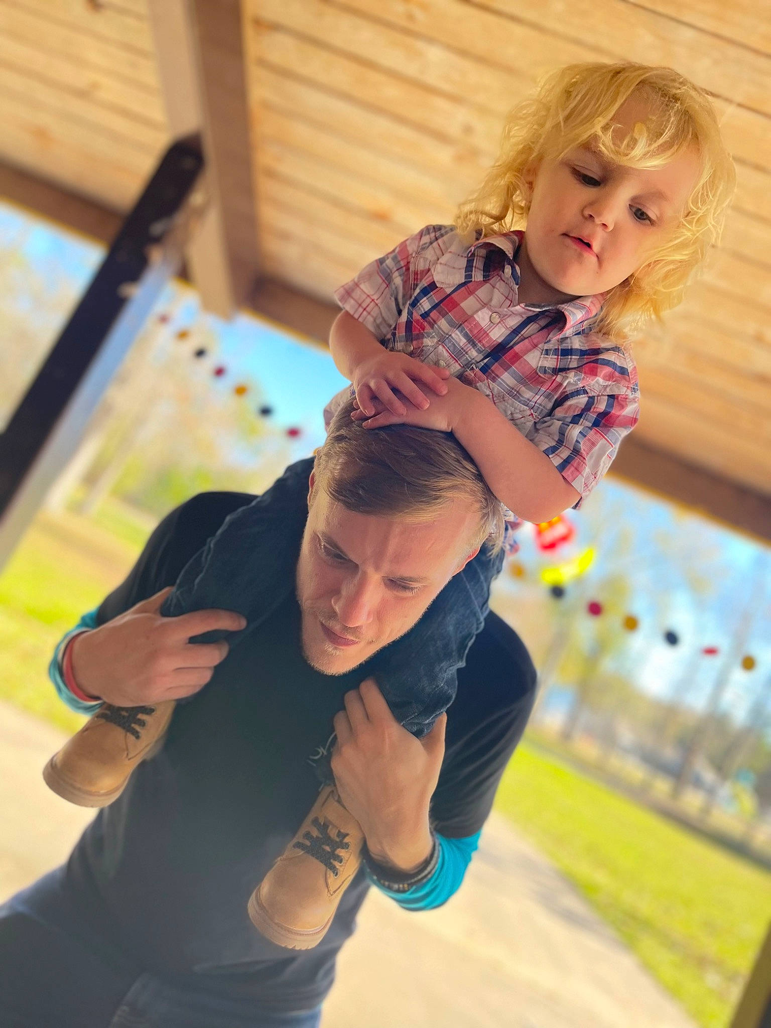 Westen is registered to the contest to win money with this photo: child, electric_blue, eyewear, flooring, fun, grass, happy, knee, leisure, person, play, recreation, sitting, sportswear, sunglasses, t_shirt, toddler, vacation, wood