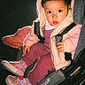 toddler, child, car_seat, hooded_jacket, pink_clothing, sneakers, indoor, portrait, baby, seated, cute, warm_clothing, footwear, looking_at_camera, young_child, infant, casual_wear, baby_shoes, seat_belt, cozy