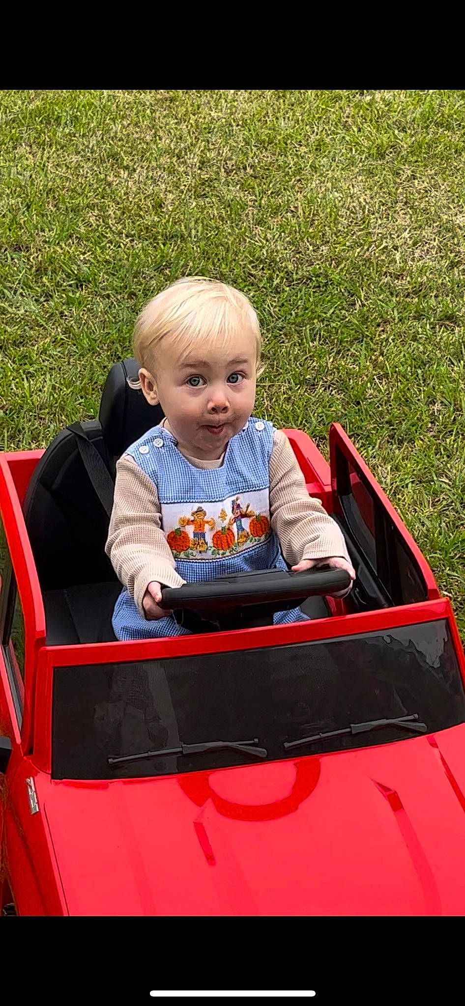 Sebastian Blaine joined the competition — help win amazing prizes! automotive_design, automotive_exterior, automotive_window_part, baby, baby_toddler_clothing, bumper, child, fun, grass, hood, leisure, motor_vehicle, person, plant, sitting, smile, surprise, toddler, vehicle, vehicle_door