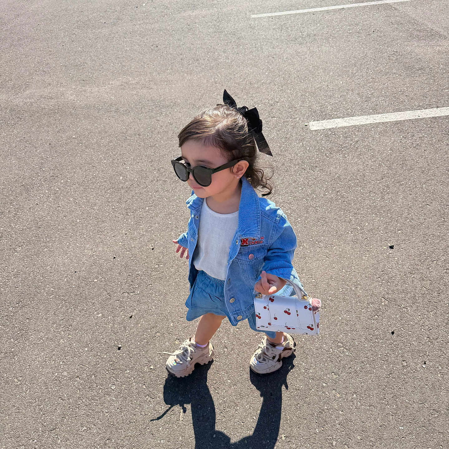Aranza Sofía Suárez joined the competition — help win amazing prizes! child, girl, outdoor, parking_lot, sunglasses, denim_jacket, denim_skirt, bow, handbag, cherries, shoes, fashion, street_style, sunlight, shadow, asphalt, cars, portrait, standing, full_body