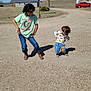 Braydon joined the competition — help win amazing prizes! child, kids, outdoor, basketball_hoop, dirt_road, blue_sky, building, car, grass, hill, sneakers, jeans, tshirt, sweatshirt, glasses, playful, posing, sunny, shadows, rural
