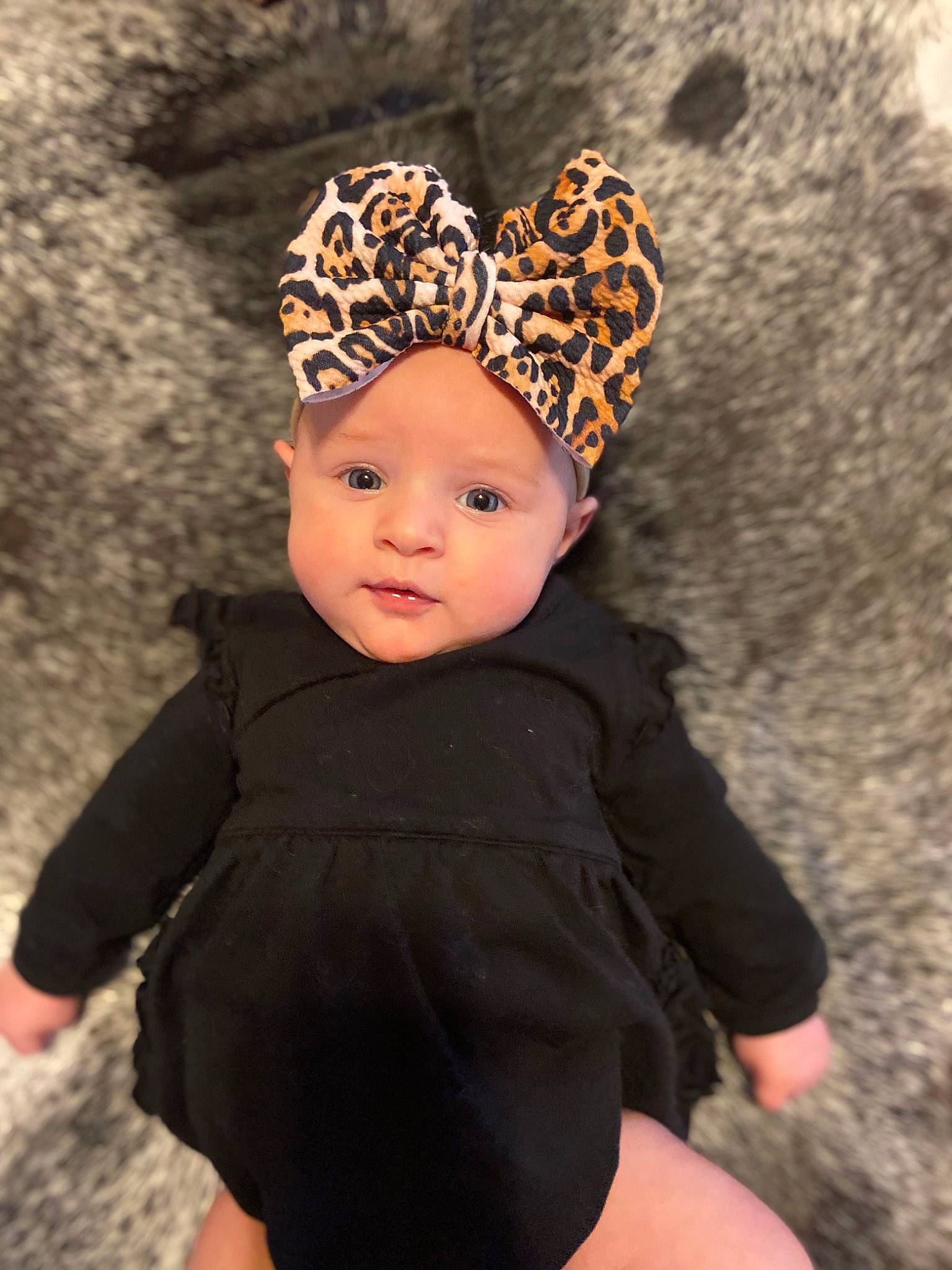 Fletcher is registered to the contest to win money with this photo: baby, baby_toddler_clothing, beauty, cap, eye, face, fawn, flash_photography, grass, hair_accessory, head, headband, headpiece, headwear, human_body, insect, jewellery, knit_cap, pattern, person