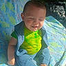Oliver joined the competition — help win amazing prizes! baby, child, dinosaur_blanket, blue_pants, green_shirt, smiling, sitting, sunlight, happy, cute, indoors, blanket, infant, cozy, relaxed, portrait, face, clothing, foot, toddler