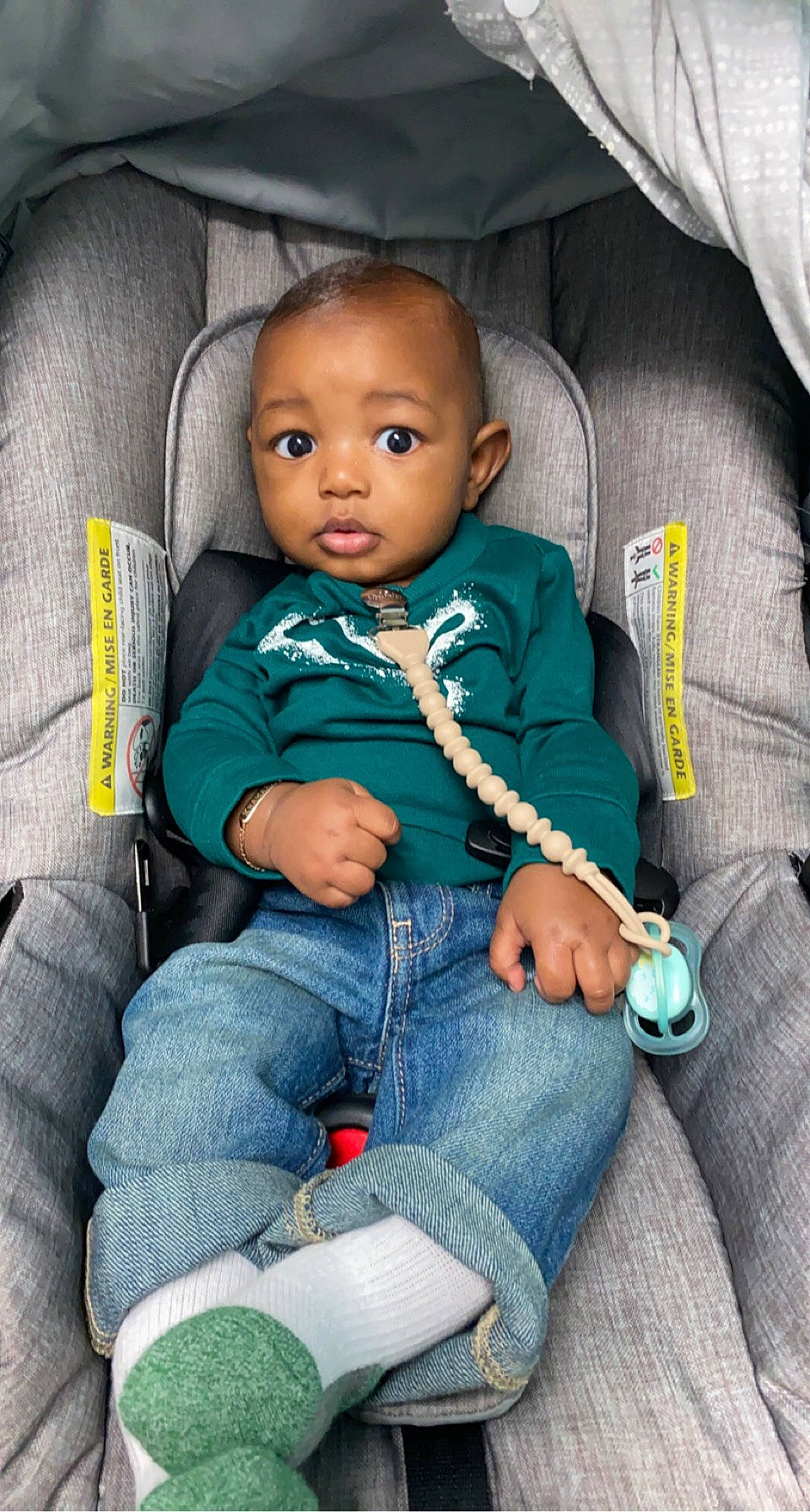 Khamari is registered to the contest to win money with this photo: auto_part, azure, baby, baby_products, baby_toddler_clothing, car_seat, chair, cheek, child, comfort, denim, electric_blue, eye, jeans, lap, person, seat_belt, sitting, sleeve, smile