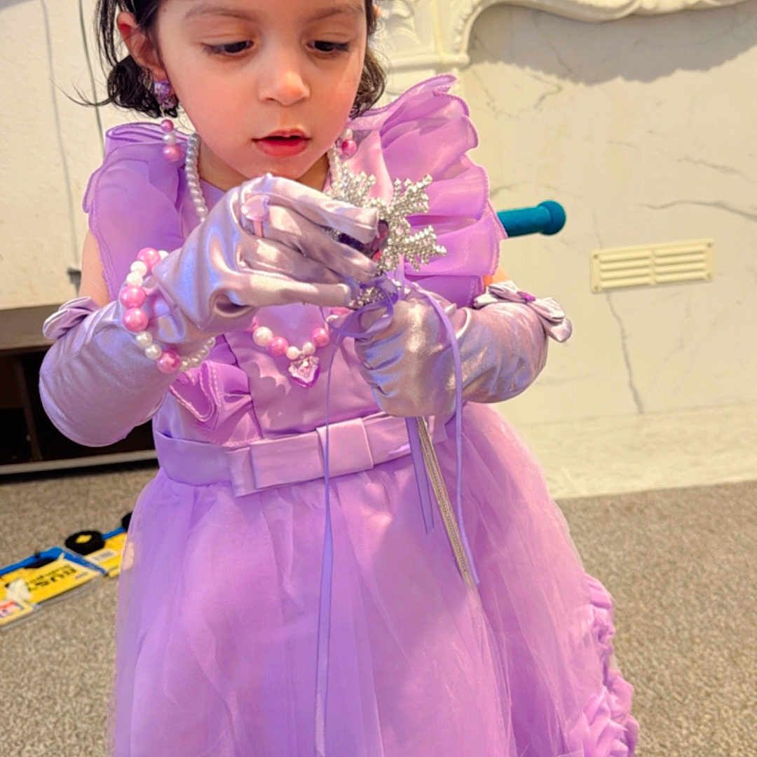 Mirha Sheikh joined the competition — help win amazing prizes! bracelets, carpet, child, costume, curly_hair, cute, decor, dress_up, focused, furniture, girl, gloves, indoor, jewelry, lavender_dress, playing, portrait, princess, tiara, wand