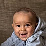 Thiago is registered to the contest to win money with this photo: apparel, baby, casual, child, cozy, crawling, cute, eyes, face, floor, hand, happy, hoodie, indoors, infant, person, portrait, skin, sleeve, smiling