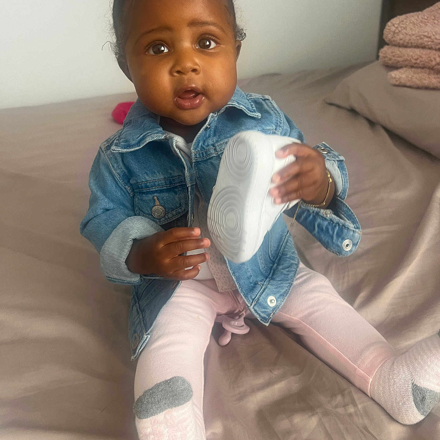 Paris is registered to the contest to win money with this photo: bodypart, child, clothing, couch, face, female, finger, footwear, furniture, girl, hand, happy, head, jeans, pants, person, photography, portrait, shoe, sitting