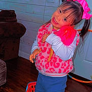 Evelyn is registered to the contest to win money with this photo: child, girl, doll, pink_bow, pink_shoes, blue_pants, pink_vest, toy_basket, wood_floor, indoor, smiling, long_hair, playtime, cute, happy, person, casual_clothing, living_room, home, portrait