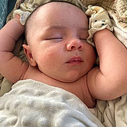 Maverick is registered to the contest to win money with this photo: baby, sleeping, blanket, mittens, infant, closeup, skin, peaceful, cute, soft, comfort, rest, child, newborn, face, arm, nap, indoors, cozy, toddler