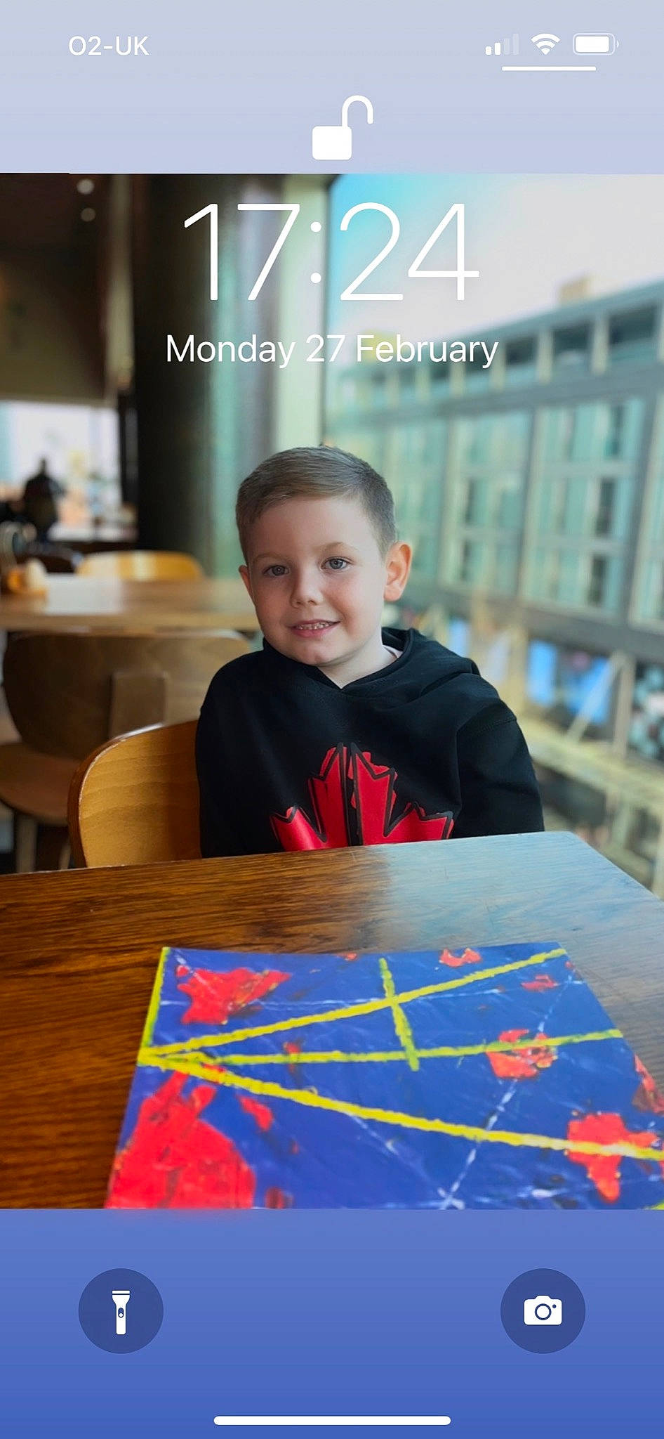 Oliver is registered to the contest to win money with this photo: art, artist, chair, electric_blue, event, flooring, fun, furniture, happy, joy, leisure, paint, person, recreation, room, smile, t_shirt, table, toddler, visual_arts