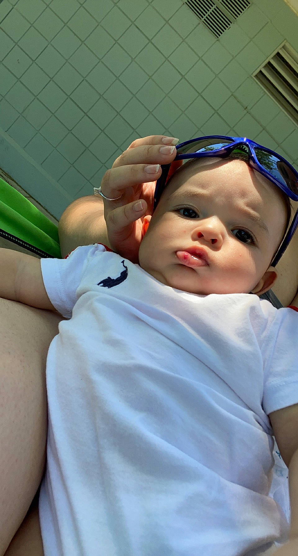 Nasir is registered to the contest to win money with this photo: baby, baby_toddler_clothing, cap, cheek, comfort, eyebrow, eyelash, eyewear, gesture, glasses, goggles, hat, lip, mouth, nose, person, service, shoulder, swimming_pool, toddler
