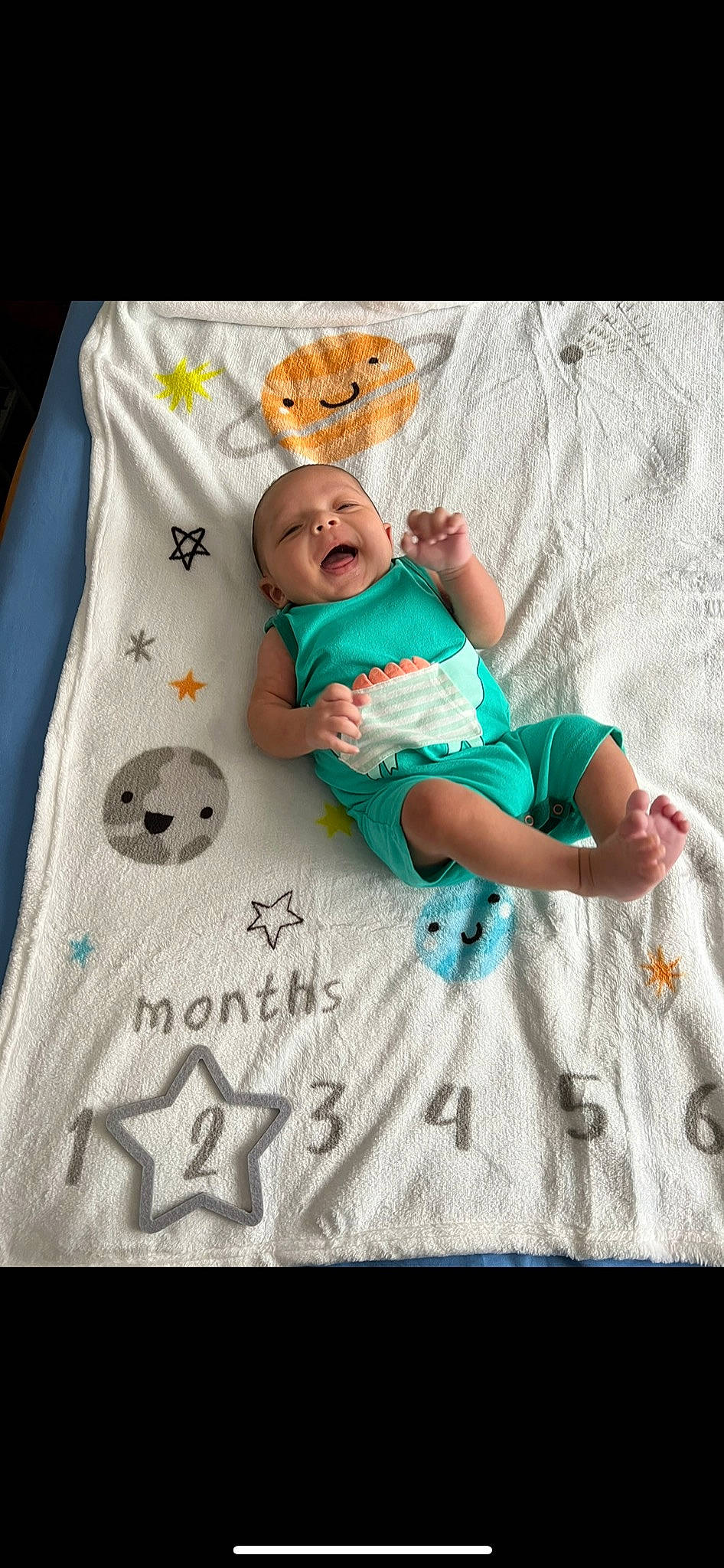Kaisyn is registered to the contest to win money with this photo: aqua, azure, baby, baby_products, baby_sleeping, baby_toddler_clothing, bedding, child, comfort, face, happy, head, linens, mammal, pattern, person, sleeve, smile, t_shirt, textile