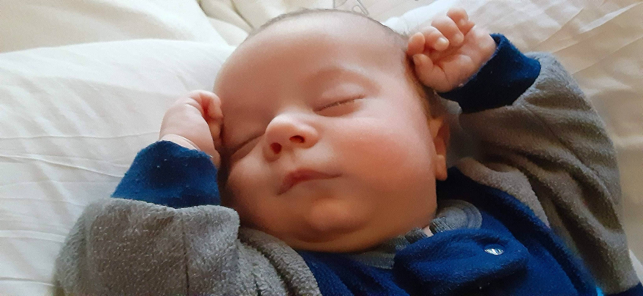 Josiah is registered to the contest to win money with this photo: baby, baby_sleeping, baby_toddler_clothing, cheek, comfort, ear, eye, eyelash, finger, forehead, gesture, hand, head, iris, lip, mouth, nose, person, skin, thumb