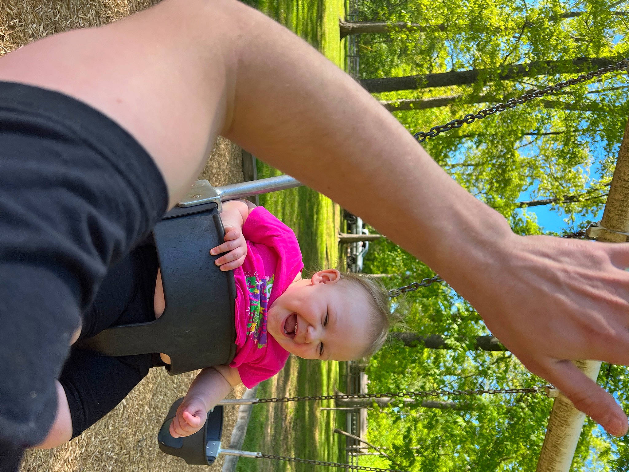 Brooklynn is registered to the contest to win money with this photo: arm, baby, elbow, finger, fun, gesture, grass, hand, happy, human_leg, joint, leisure, people_in_nature, person, plant, smile, thigh, thumb, toddler, tree