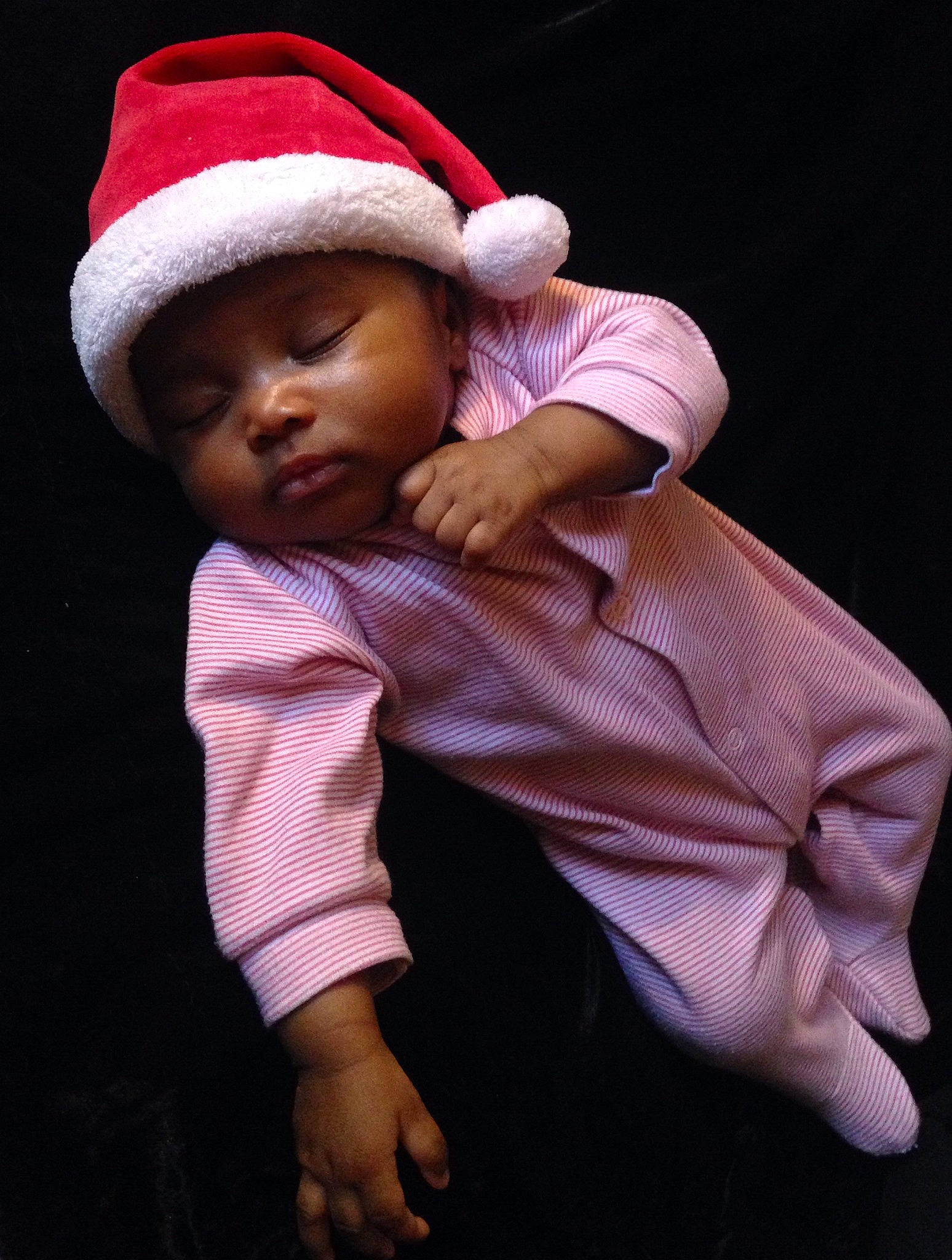 Aura is registered to the contest to win money with this photo: baby, cheek, child, hand, hat, headgear, headwear, person, photography, pink, smile, toddler