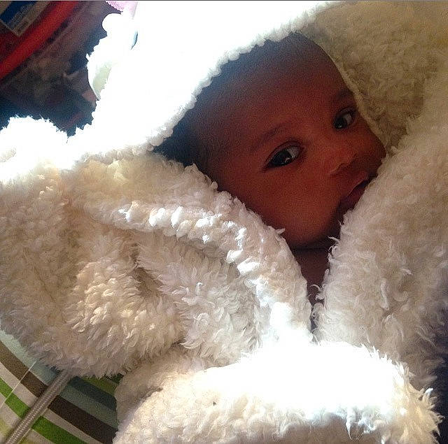 Aura is registered to the contest to win money with this photo: baby, child, fur, nose, person, smile, stuffed_toy, toddler, wool