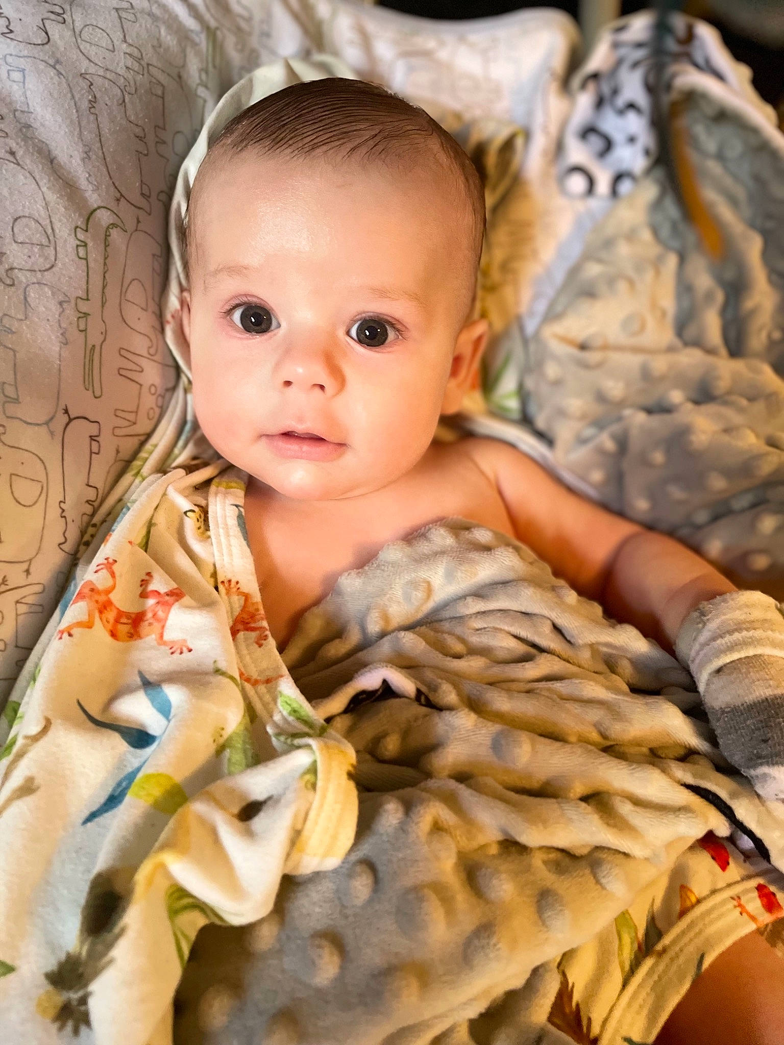 Atlas is registered to the contest to win money with this photo: baby, baby_toddler_clothing, blond, cheek, child, close_up, comfort, eye, flash_photography, iris, linens, military_camouflage, neck, nose, pattern, person, skin, sleeve, textile, toddler