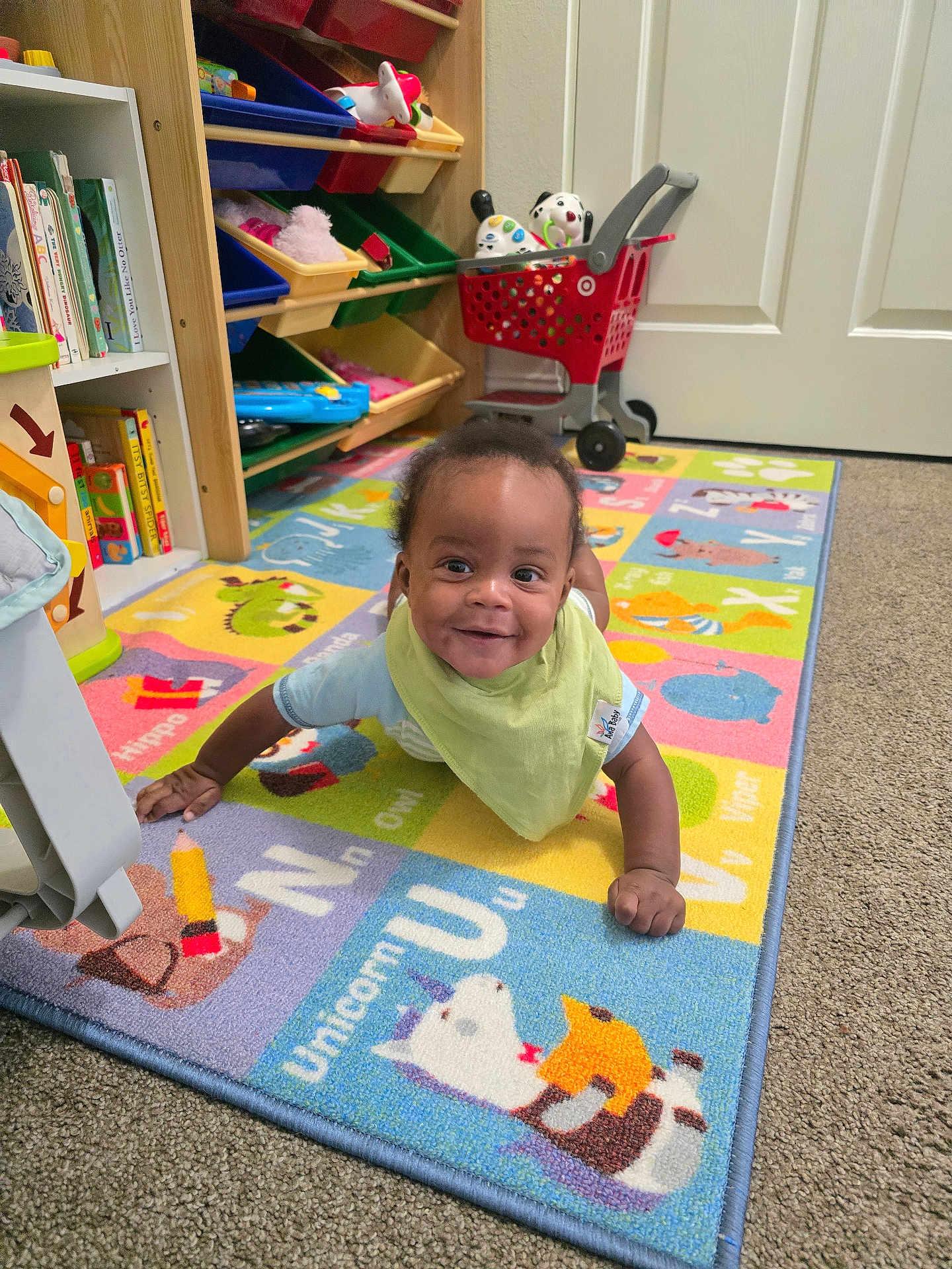 Thunder joined the competition — help win amazing prizes! baby, child, smiling, playroom, rug, alphabet, toy, bookshelf, carpet, floor, indoor, colorful, clothing, bib, person, happy, infant, play, furniture, cute