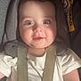 Eli is registered to the contest to win money with this photo: baby, child, car_seat, seatbelt, white_shirt, drool, happy, face, infant, straps, padded, safety, cute, closeup, portrait, indoors, headrest, smile, young, person