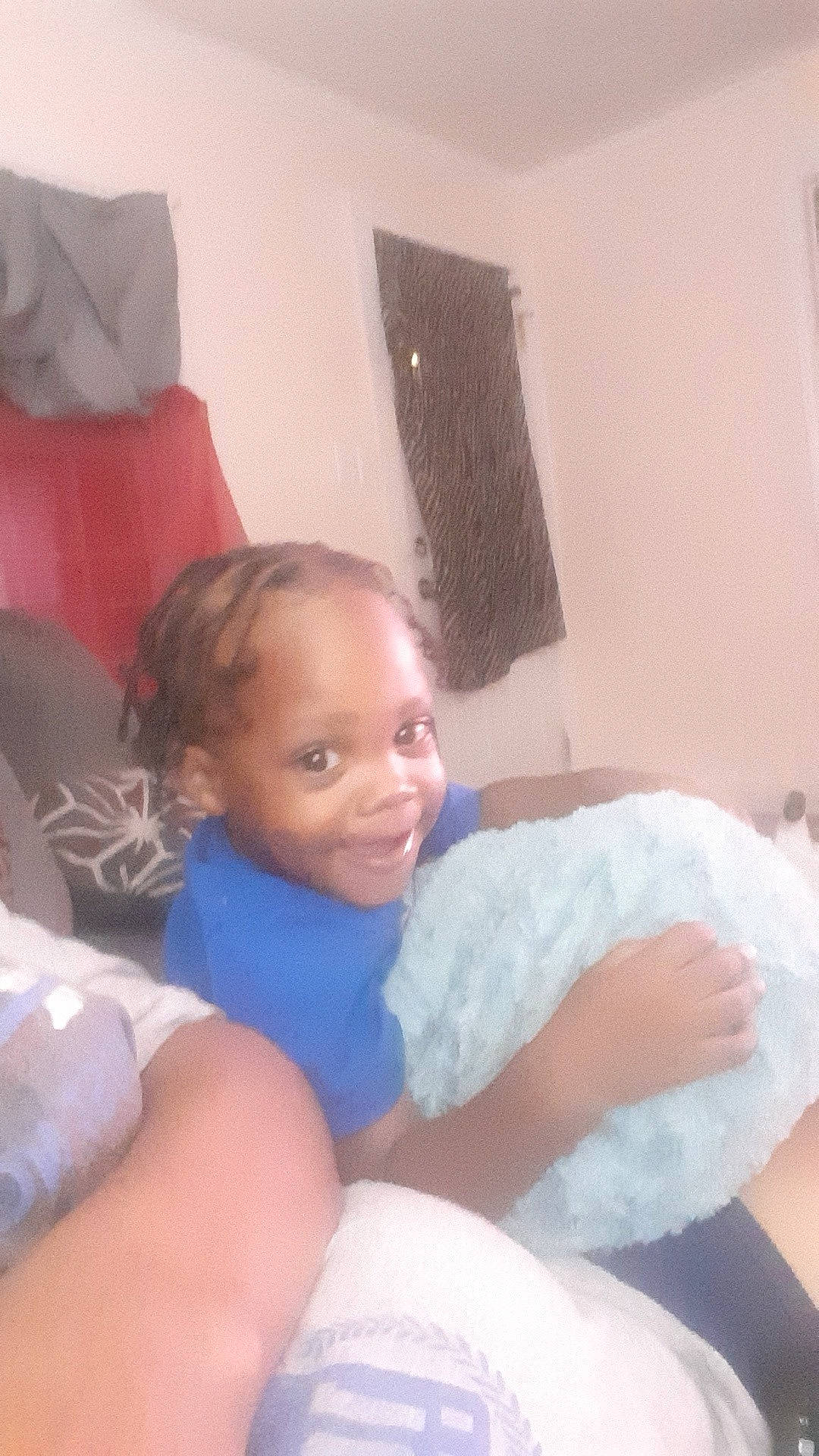 Major is registered to the contest to win money with this photo: bedding, comfort, elbow, eye, fun, happy, human_leg, joint, joy, knee, lap, leg, linens, muscle, person, room, shoulder, sitting, skin, smile