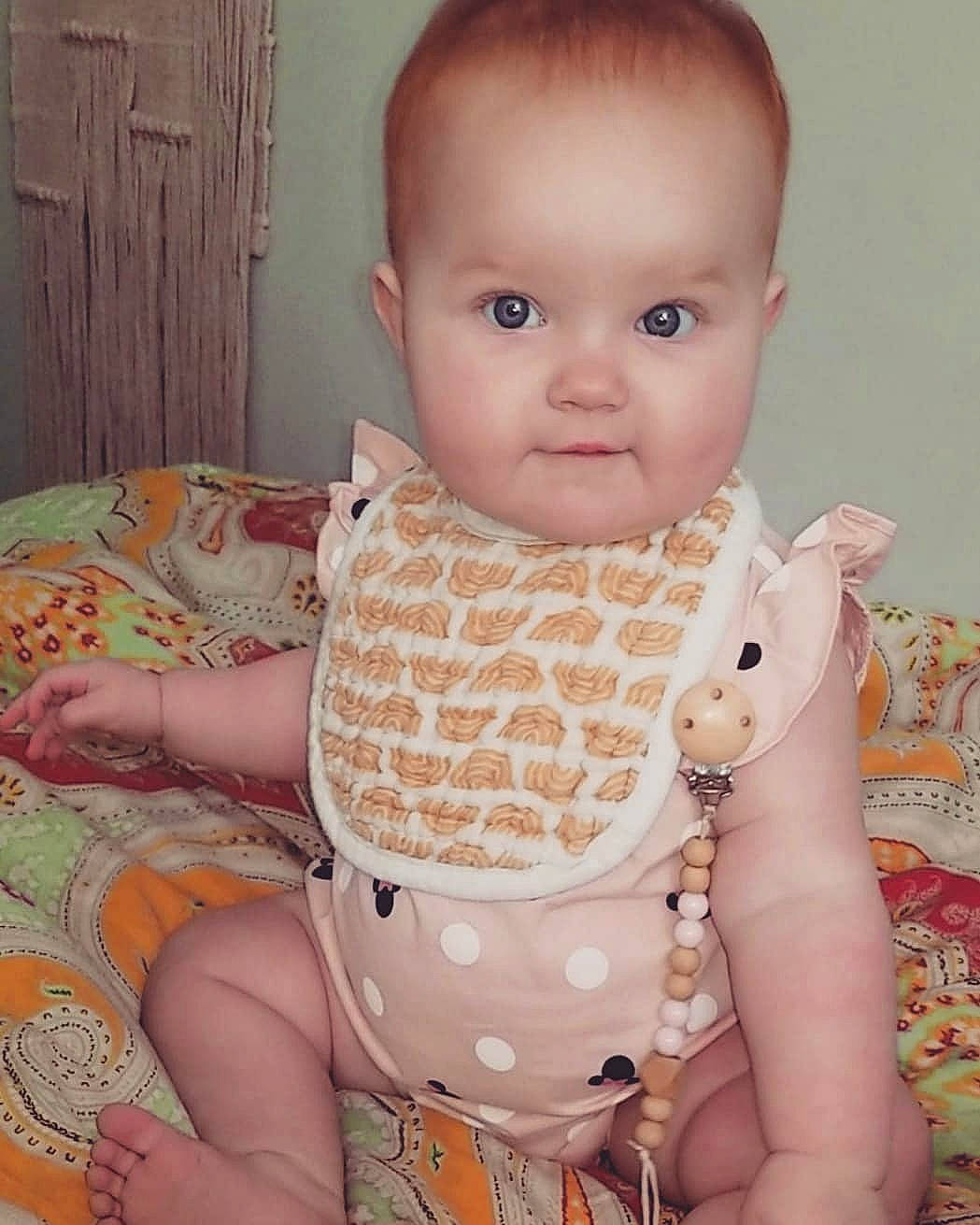 Hallie Jane joined the competition — help win amazing prizes! abdomen, baby, baby_toddler_clothing, cheek, chest, child, comfort, finger, infant_bodysuit, iris, lip, neck, nose, pattern, person, pink, sitting, skin, sleeve, stomach