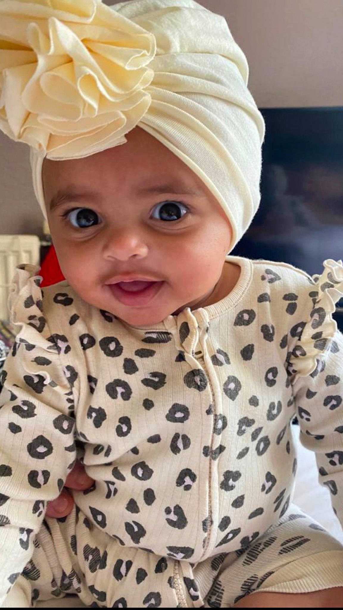 Lottie joined the competition — help win amazing prizes! baby, baby_toddler_clothing, cap, cheek, child, face, facial_expression, happy, headgear, headpiece, headwear, lip, organ, outerwear, pattern, person, pink, skin, sleeve, textile