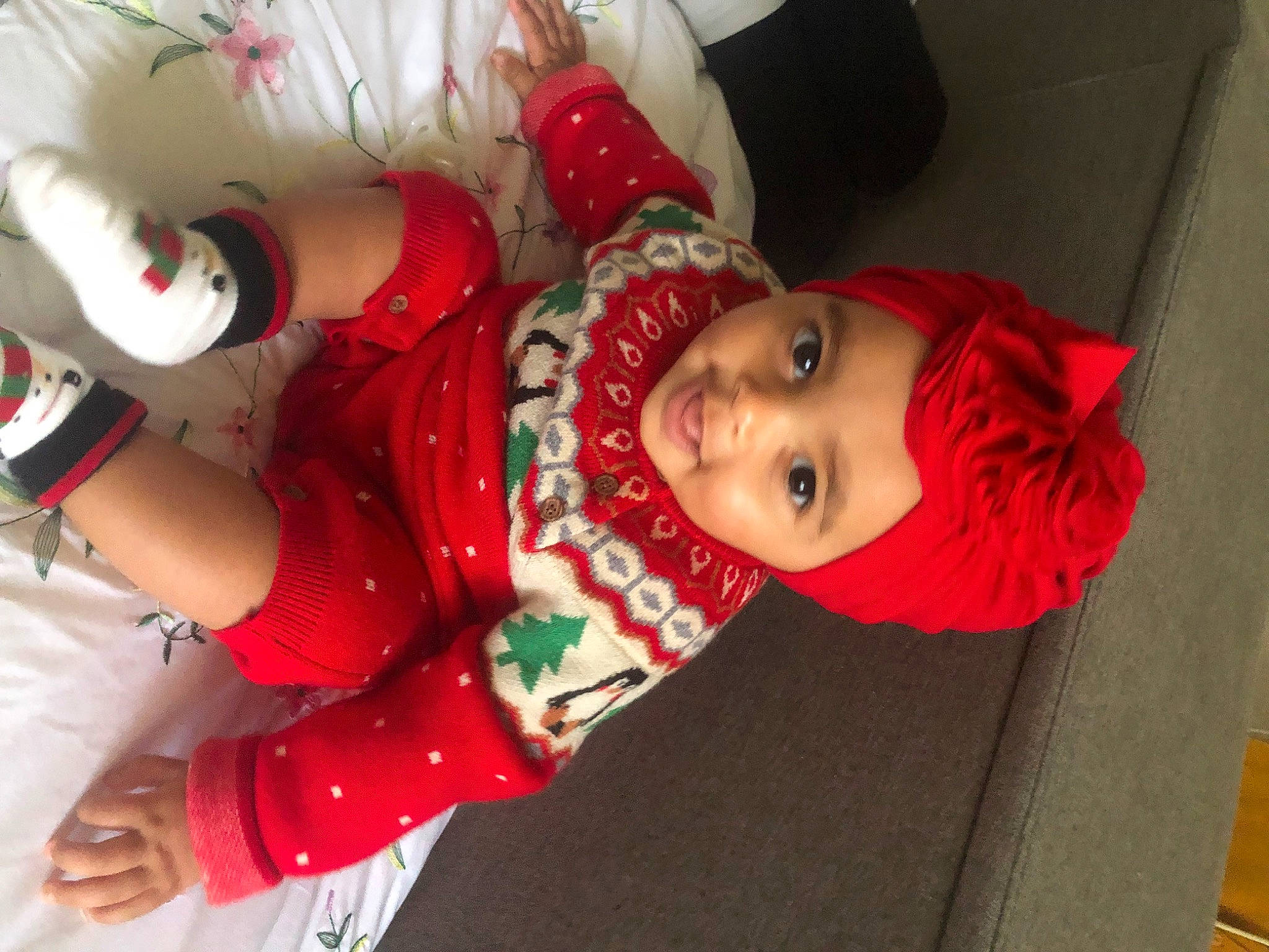 Lottie joined the competition — help win amazing prizes! baby, baby_toddler_clothing, carmine, child, christmas, christmas_eve, event, fun, happy, hat, headwear, holiday, pattern, person, product, room, sleeve, smile, toddler, tradition