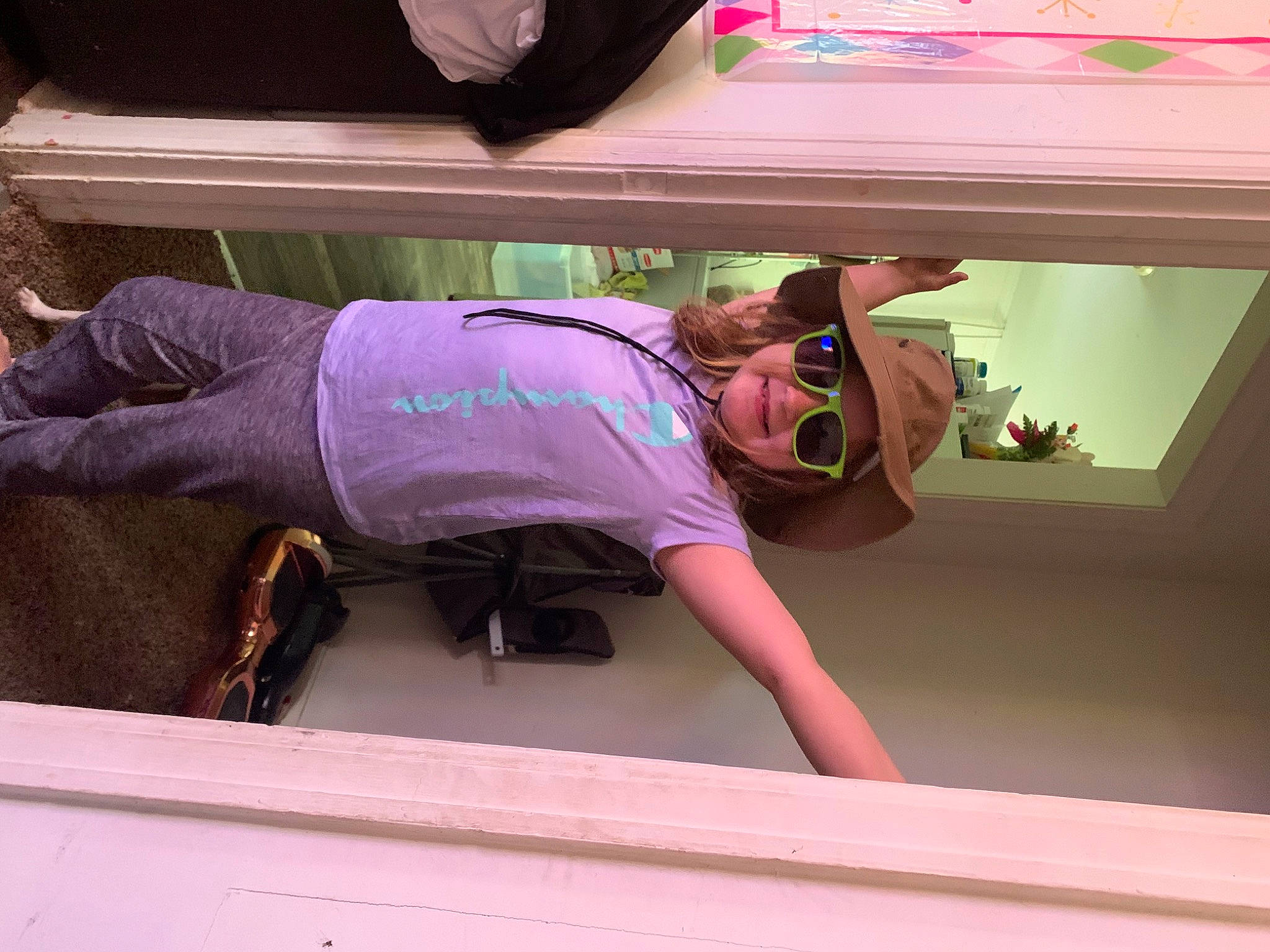 Sierra is registered to the contest to win money with this photo: comfort, elbow, fun, hat, headwear, human_leg, joint, joy, knee, magenta, person, pink, purple, room, sandal, shorts, shoulder, sleeve, sportswear, t_shirt