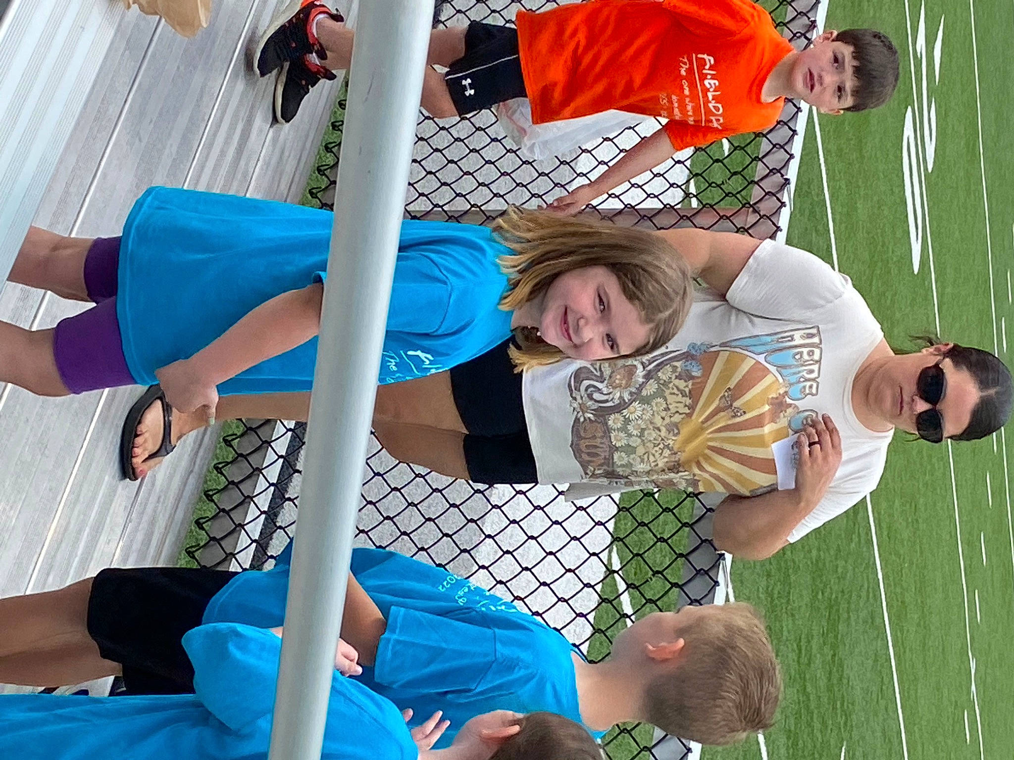 Sierra is registered to the contest to win money with this photo: ball_game, clothing, electric_blue, fun, grass, green, happy, hat, joy, leisure, net, person, player, product, recreation, shorts, t_shirt, team, team_sport, thigh