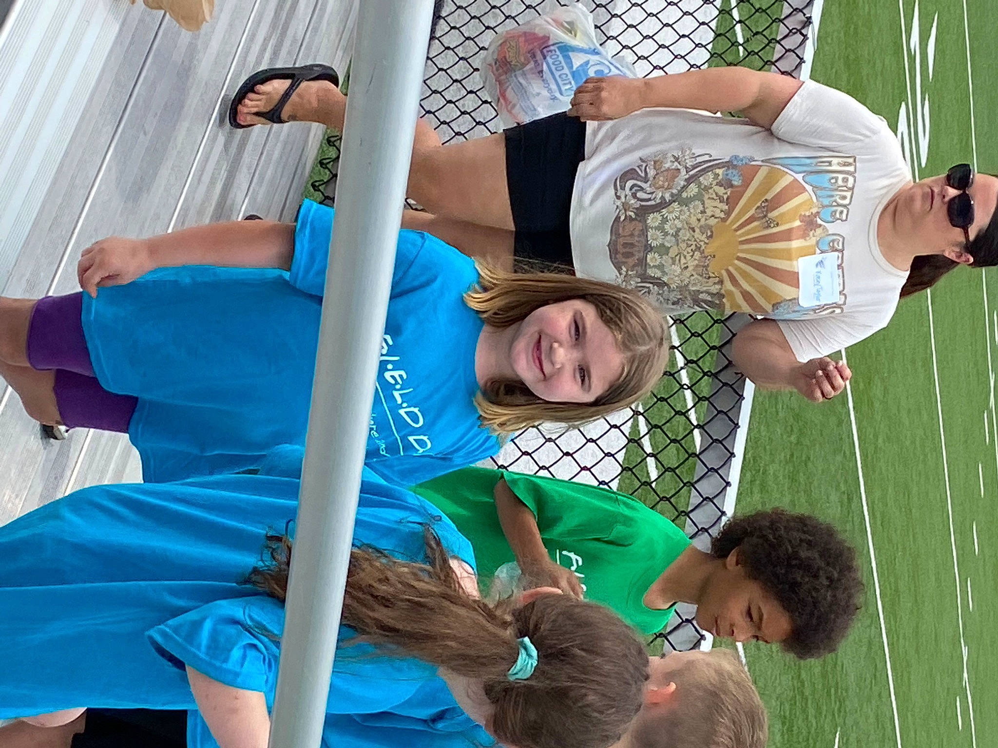 Sierra joined the competition — help win amazing prizes! arm, child, electric_blue, event, fun, grass, green, happy, joint, joy, leisure, muscle, net, person, player, recreation, shorts, smile, t_shirt, team