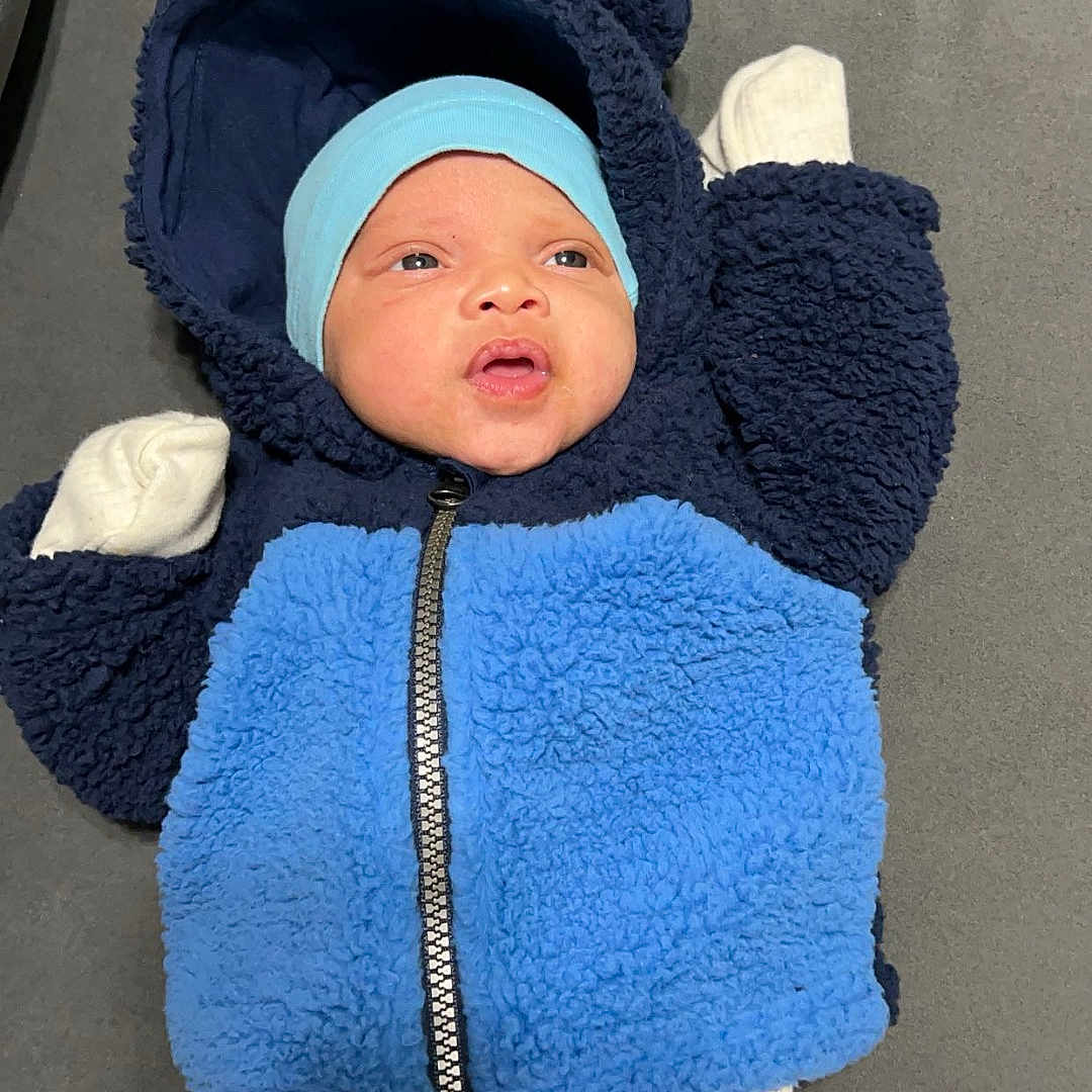 Xealyn joined the competition — help win amazing prizes! baby, blanket, bonnet, cap, clothing, coat, face, glove, hat, head, hood, hoodie, jacket, knitwear, newborn, person, photography, portrait, sweater, sweatshirt