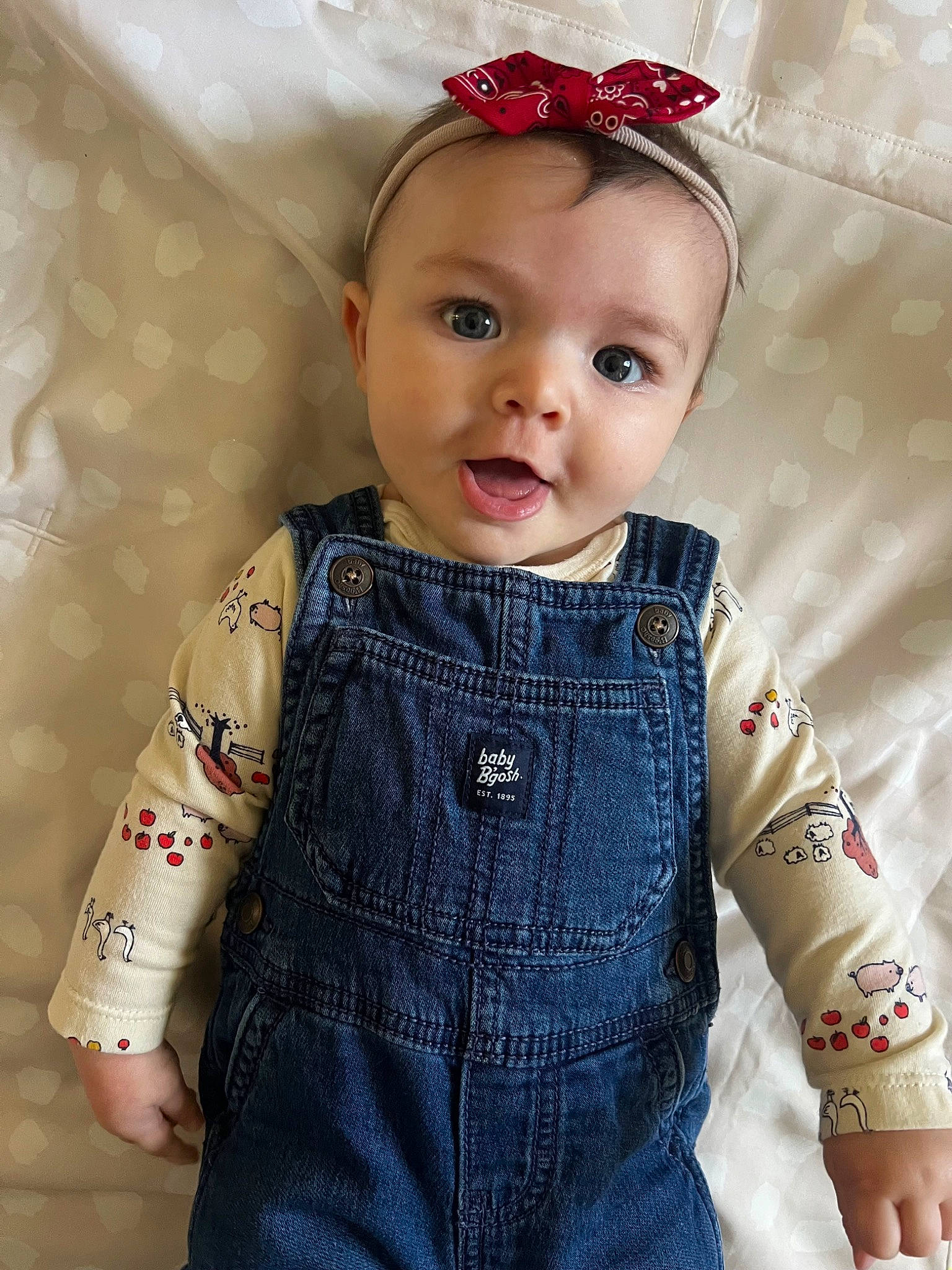Isla joined the competition — help win amazing prizes! arm, baby, baby_toddler_clothing, cheek, child, clothing, collar, dress, eyelash, human_body, jewellery, lip, neck, pattern, person, pink, skin, sleeve, standing, surprise