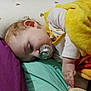 Fiurenzu participe au concours pour gagner de l'argent avec cette photo : baby, sleeping, pacifier, blanket, bed, pillow, child, infant, rest, cozy, face, hand, yellow, purple, white, pattern, soft, cute, peaceful, indoors