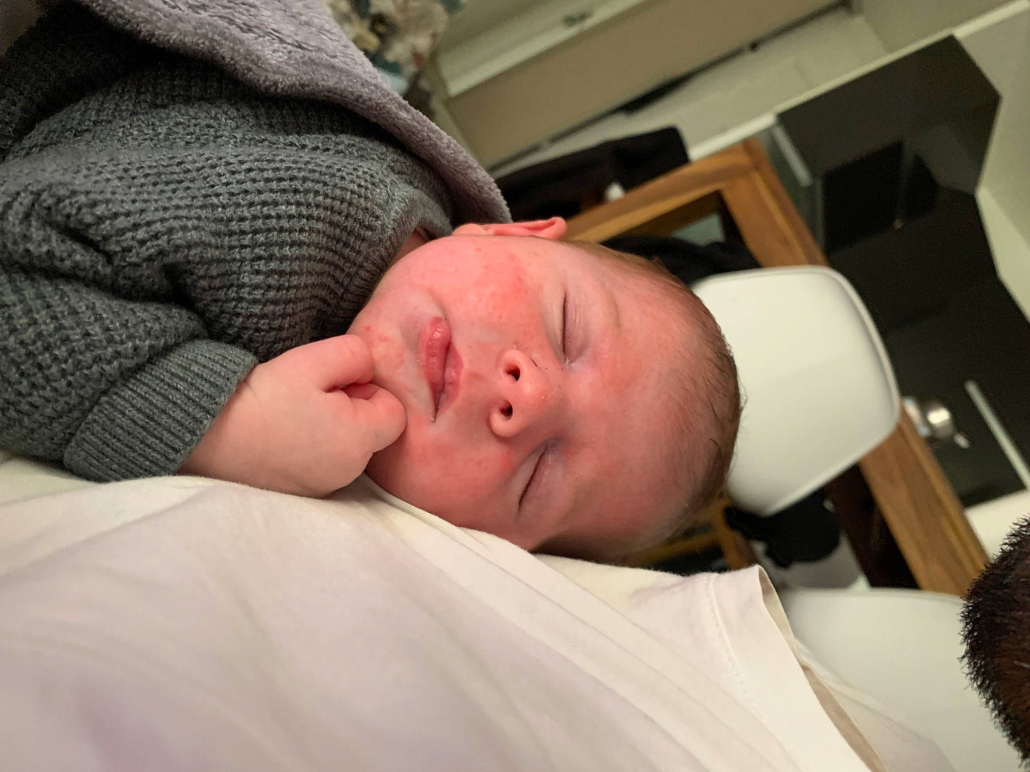 Andrea participe au concours pour gagner de l'argent avec cette photo : abdomen, baby, bedtime, chair, cheek, child, comfort, elbow, eye, eyebrow, eyelash, flesh, hat, linens, mouth, nap, nose, person, room, sleep